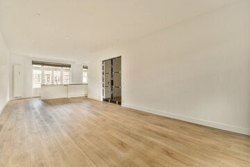 an empty living room with wood flooring and white walls in the room is very clean, but there is no furniture