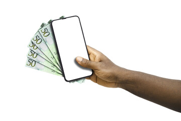 Black hand holding mobile phone with blank screen and Libyan dinar notes
