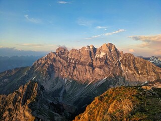 Hike to the Fronalpstock with a view of the Mürtschenstock in Glarus. Beautiful evening mood in the Swiss mountains. High quality photo