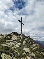 Fototapeta na wymiar Summit cross on the Hauerkogel mountain in Austria above Langenfeld near Solden. Super nice view. High quality photo.
