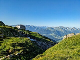 Fototapeta na wymiar Zwinglipasshütte SAC, Climbing on the Altma Altmann in the Alpstein Appenzell area. Fantastic mountain panorama. Wanderlust Switzerland. Fahlensee lake. Faelensee. High quality photo