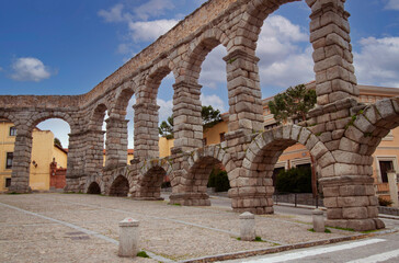 The historical Aqueduct Bridge of Segovia (Spain, Europe) is a Roman granite stone viaduct in the old town. The ancient water-conveyance structure carries water from the Frío River to the city.