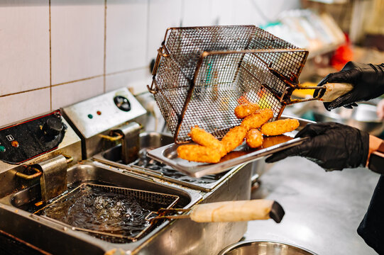 Close up image of cooking chicken nugget tempura in deep fry on kitchen