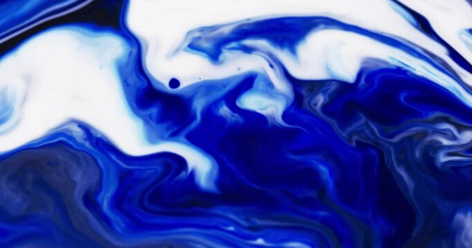 Video of close up of blue and white ink in water with copy space
