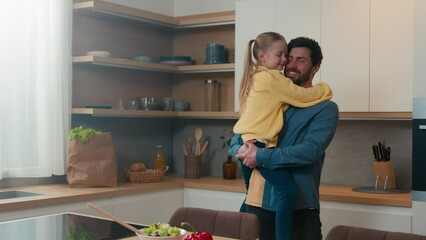 Happy family loving father holding little adopted daughter child love bonding trust affectionate at home kitchen kid girl and man dad touch noses having fun nose kiss enjoy time together in morning