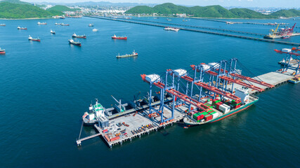 Cargo container Ship running on Bridge Cargo Shipyard. Container ship under the crane Sea Port...