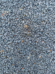 Black all-weather synthetic track surfacing made of polyurethane used for track and field competitions