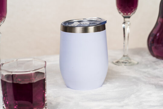 Skillfully executed mockup showcasing a white wine tumbler amid a minimalistic drink arrangement