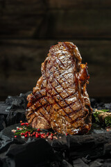 porterhouse steak or T Bone Steak. vertical image. place for text