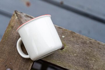 Skillfully arranged for mockup purposes, the image features a white mug in a simple and tidy style, ready to enhance your branding efforts