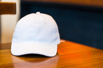 The image captures a white blank hat, arranged with a simple and tidy style, offering a captivating design concept