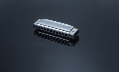A compact harmonica instrument tool - obrazy, fototapety, plakaty