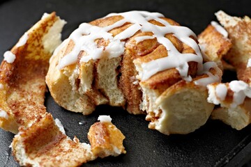 Sweet Temptation: Close-Up of Cinnamon Rolls Placed on a Wooden Surface, Tempting Your Senses in 4K Resolution