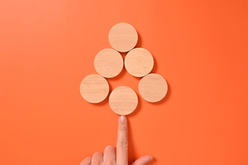 Hand with wooden blocks and cubes mock up on background, Copy space, Wooden blocks with copy space for text or symbols, Background with copy space