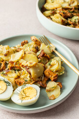 Delicious hearty dinners or lunches, fried young potatoes with forest mushrooms Chanterelles with dill, boiled eggs, seasonal food