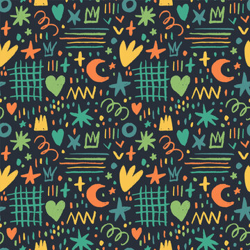 Multi colored childish doodle seamless pattern on dark background. Childish style charcoal drawing. Crowns, dots, grid and squiggles drawn with colorful charcoal or chalk. Fun seamless pattern.