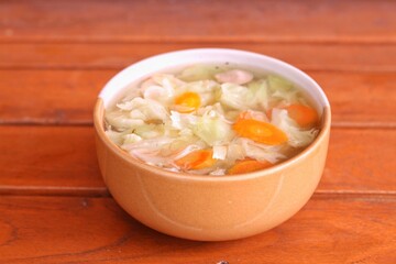 Bowl of delicious vegetable soup on a table