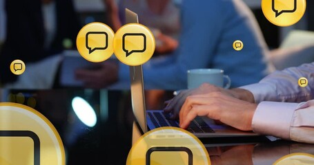 Animation of message icons moving over cropped hands of caucasian woman working over laptop in cafe - Powered by Adobe