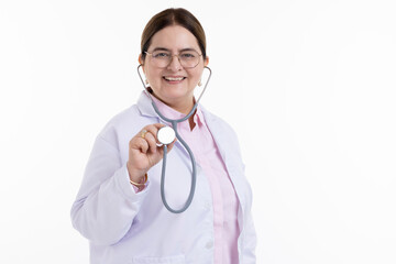 Senior doctor in white coat holding stethoscope against white background