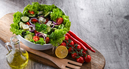 Composition with a vegetable salad bowl