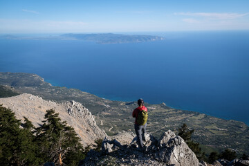 Epic scenery with hiker on top of Mount Ainos, the tallest mountain on the Ionian island of Cephalonia