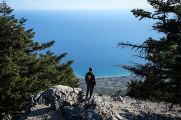 Epic scenery with hiker on top of Mount Ainos, the tallest mountain on the Ionian island of Cephalonia - 626242043