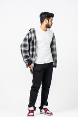Fototapeta premium Expertly composed, the image portrays a man donning a white blank shirt, elegantly posed with a smile, perfect for enhancing your marketing materials
