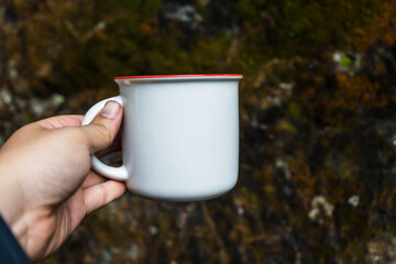 Skillfully arranged for mockup use, the mug complements the natural scenery, artfully arranged with simplicity in mind