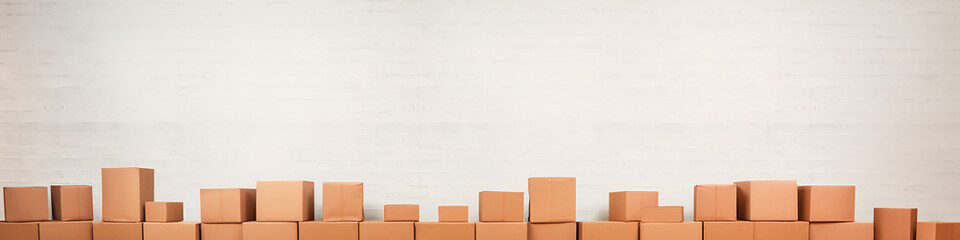 cardboard boxes isolated on a long narrow white background panorama row.