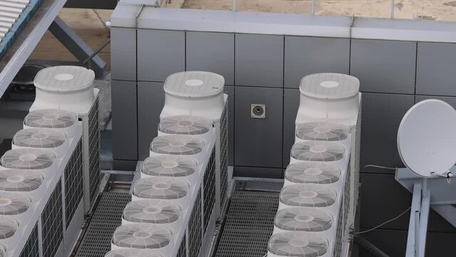 Row of Air Conditioner Hvac Units at Building Rooftop tilt up