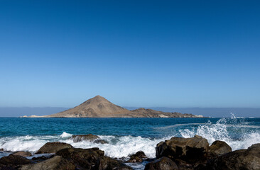 Isla Pan de Azúcar in the National Park Pan de Azúcar viewed from the coast of the Atacama desert...
