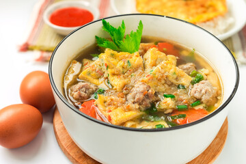 Fototapeta premium Thai food - Omelet soup with Omelette rice and chili sauce