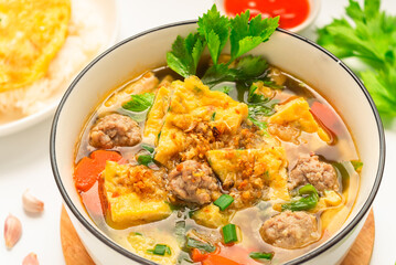  Omelet soup with minced pork on white background - thai food