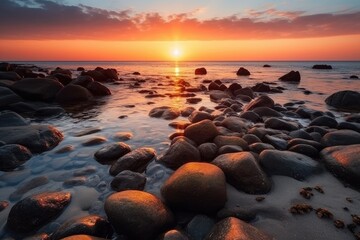Obraz premium Very nice sunset on a beach with many rocks