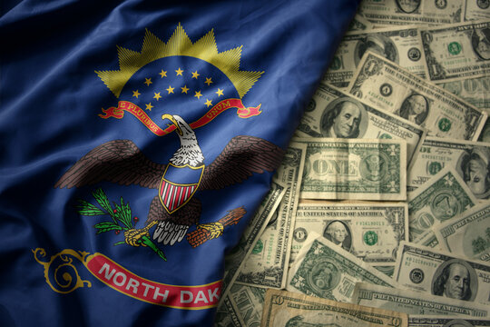 colorful waving national flag of north dakota state on a american dollar money background. finance concept