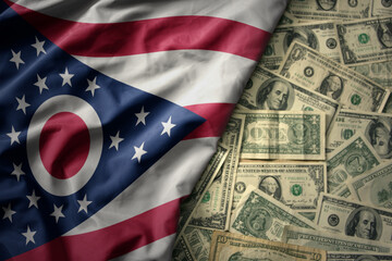 colorful waving national flag of ohio state on a american dollar money background. finance concept - obrazy, fototapety, plakaty