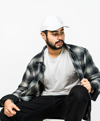 Captivatingly arranged, the image showcases a man in a simple pose, donning a white blank shirt and...