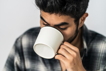 The mockup highlights a man displaying a white blank mug, offering a versatile visual asset for your projects