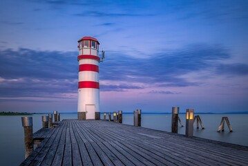Podersdorf lighthouse at the end of the pier on the Neusiedler See in Austria at dawn 