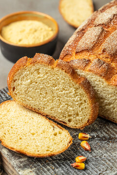 Traditional Portuguese Corn Bread on a wooden board, banner, menu, recipe place for text, top view