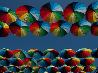 Colourful umbrellas underneath the blue sky