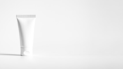 Simple blank cream tube mockup. White beauty product package mock-up. Banner background with copy...