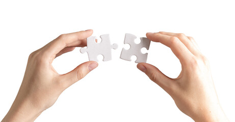 Hand joining, connecting two puzzle pieces together. Business and psychology concept of problem solving, success
