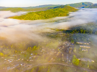 Photos of the hills and the village were taken from a drone in the early morning.  Kuldur is an urban—type settlement in the Irradiation district of the Jewish Autonomous Region of Russia. Resort. 