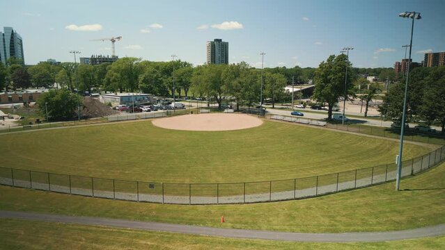 Aerial View of Green Baseball Field, Baseball Diamond, Sports Field, Public Park in Halifax, Canada. Drone Shot at an Empty Baseball Field Downtown.