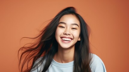 Fototapeta premium Asian Girls' Education. Happy beautiful Asian Girl is smilling on color background. Generative AI