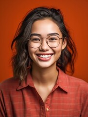 Fototapeta premium Asian Girls' Education. Happy beautiful Asian Girl is smilling on color background. Generative AI