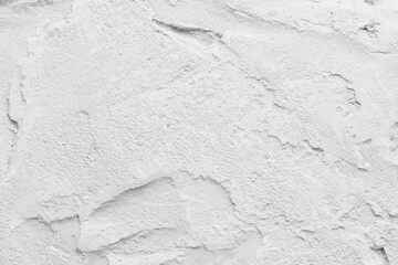 Decorative white putty background. Wall texture with filler paste applied with spatula, chaotic...