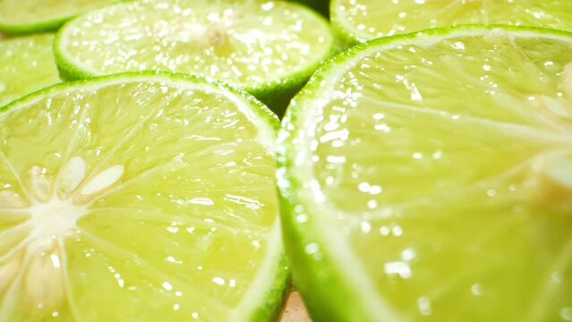 Macro video: Discover mesmerizing details of half green lemons. Probe lens captures intricate textures, vivid hues, and tangy essence in 4K.
