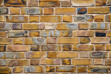 Architectural wall background with brown bricks. Abstract textured details